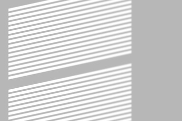 Soft sunlight filtering through window blinds creates a modern, clean geometric shadow overlay