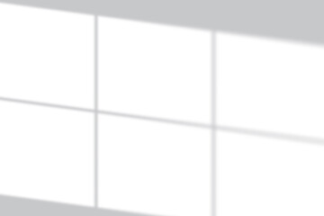 Soft window light creates a serene grid shadow overlay on a clean white background, perfect for modern design.