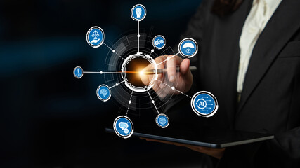 A business professional interacts with a touchscreen to display various digital icons representing innovation and technology in a modern work environment. Crux
