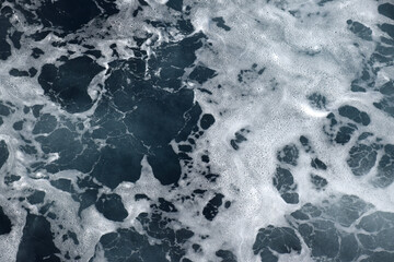 The beach foam in the sea is pure like silk