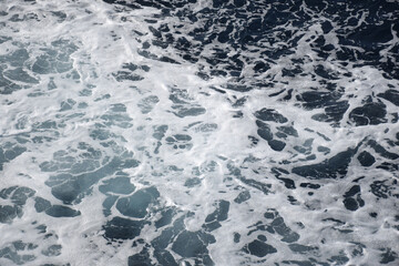 The beach foam in the sea is pure like silk