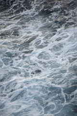 The beach foam in the sea is pure like silk