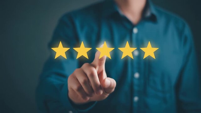 Professional man in blue shirt poses for a studio portrait