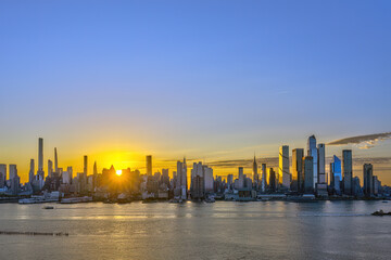 The skyline of Midtown Manhattan in New York at sunrise seen from Weehawken, New Jersey