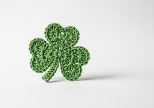 A single green sparkly shamrock clover symbol of luck isolated on white background