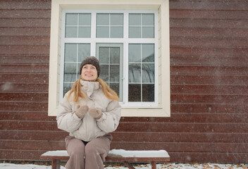 young woman sitting on a bench