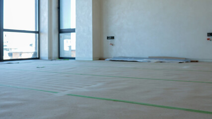 Interior of a new apartment during renovation with large windows