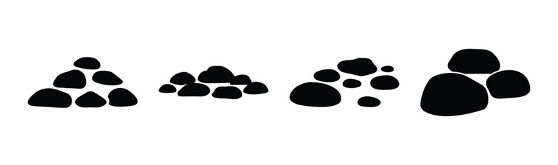 Black smooth pebbles stacked in various small piles on white