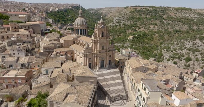 Aerial view of the Cathedral of San Giorgio, located in the historic center of Ragusa Ibla, Sicily, Italy. It is a Catholic church with a beautiful facade, an example of Baroque architecture.