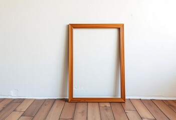 A simple wooden frame leaning against a white painted wall, composition, wooden