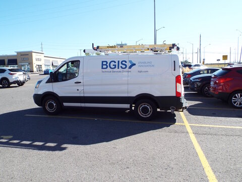  Gloucester, ON, Canada-June 26,2025:A white commercial van belonging to "BGIS" on Ogilvie Rd.