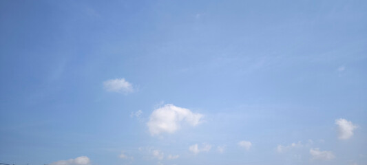 Sky is blue and clear with no clouds. The sky is very bright and the sun is shining. Blue sky with scattered white clouds creating a serene and peaceful atmosphere. Ideal for backgrounds. nature theme