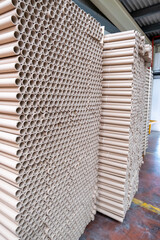 Stack of cylindrical cardboard tubes.