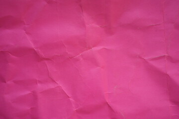 Fototapeta premium pink crumpled paper texture as background, old kraft paper as background, crumpled packing material texture as background photo above 