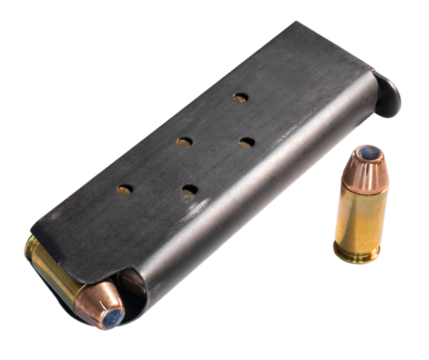 Full loaded 1911 style magazine with bullets and one outside