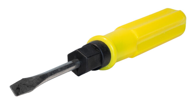 Large flat end of a screwdriver with a yellow handle angled toward the viewer