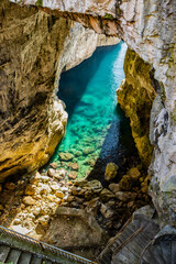 Gaeta, Latina, Lazio, Italy. A splendid view of the city. The ancient village with its houses overlooking the sea. The spectacular Grotta del Turco on the Montagna Spaccata (Split Mountain) cliff.