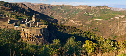 Tatev - 9th-century Christian monastery standing on a large basalt plateau on the edge of a deep gorge of the Vorotan River - main historical landmark of the region. Tatev, Syunik Province, Armenia