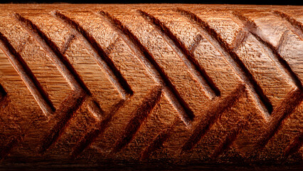 Bird's eye perspective of cricket training agility ladder on pitch with ball and stumps, fitness equipment