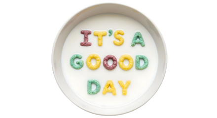 Cereal letters spelling out it's a good day in a bowl of milk on a white background overhead view