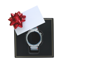 Modern silver smartwatch in black box with blank white card and red bow isolated transparent background. Top view flat lay of technology gift for Father's Day or birthday present, holiday concept.