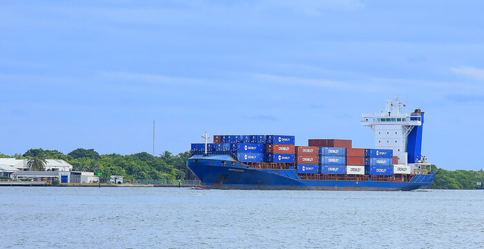Crowley shipping containers loaded on the Paradero freighter ship leaves Port Everglades, Fort Lauderdale, Florida, USA. 