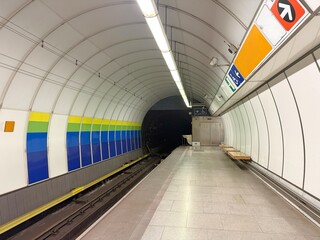 Empty metro station overlooking a tunnel in Prague
