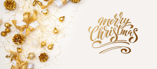 Merry Christmas and Happy New Year greeting card, frame, and banner. Holidays design. Noel and Feliz Navidad. Christmas gifts and decorations, top view. Flat lay.