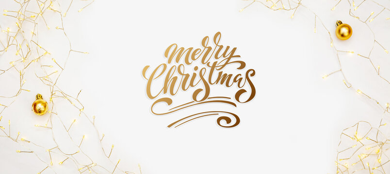 Merry Christmas and Happy New Year greeting card, frame, and banner. Holidays design. Noel and Feliz Navidad. Christmas gifts and decorations, top view. Flat lay.