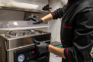 Cook working in restaurant kitchen preparing meals