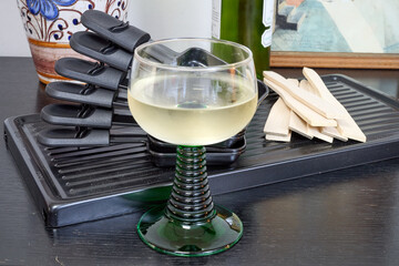 Raclette trays and wooden pallets on table