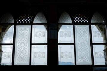 Elegant Islamic Calligraphy Design Glass Window Interior of a Mosque Architecture