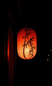 Red Japanese lantern illuminated at night representing Japan Day  