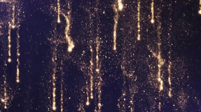Golden sparkling cascade with shimmering particles on dark background  