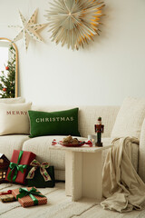 Warm holiday living room with Christmas cushions, wrapped gifts, and soft neutral textures creating...