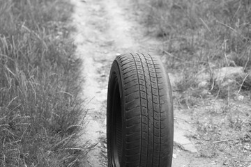 old worn damaged tire as pattern of damaged tire for advertising tire shop or car tire shop