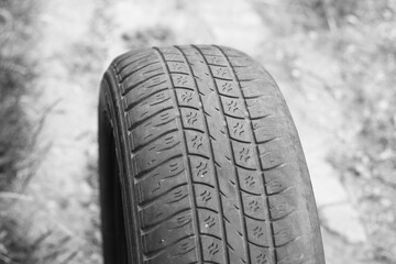 old worn damaged tire as pattern of damaged tire for advertising tire shop or car tire shop