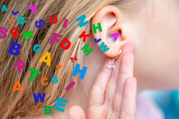 Closeup young child's ear, colorful letters, child’s struggle to perceive spoken words, childhood hearing disorders and misunderstood speech, challenges auditory, learning difficulties, correction