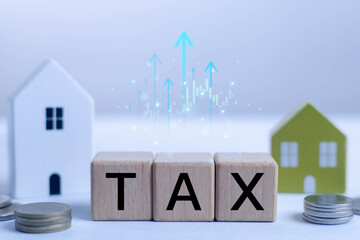 Wooden blocks spelling TAX with coins and house models, representing property tax, financial planning, investment strategy, and economic growth, ideal for finance content, business ads.