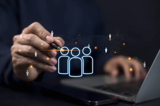 Businessman using digital technology for human resource management, recruitment, and team connection. Concept of networking, employee data, and HR innovation in modern business. - Powered by Adobe