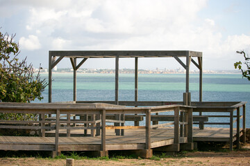 Wooden gazebo on a cliff overlooking the ocean