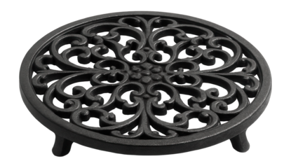 Decorative cast iron trivet for safeguarding tables from hot dishes at events.