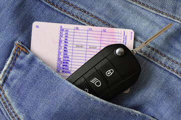 Car key and driving license in jeans pocket