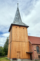 Historic Catholic parish church with a wooden bell tower in the village of Sieniawa