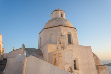 Fototapeta premium Golden Hour on the Dome of the Fira Cathedral, Santorini, Greece