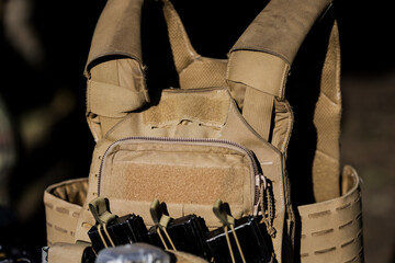 Details with a militaryvest and helmet