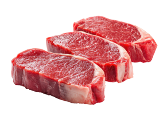 Three raw beef steaks, close-up, against a black background