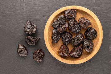 Dried sweet prunes, top view, macro.