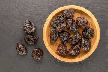 Dried sweet prunes, top view, macro.