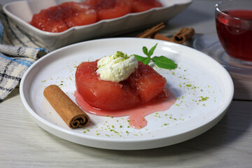 Ayva Tatlısı - Quince dessert served with clotted cream and powdered pistachios